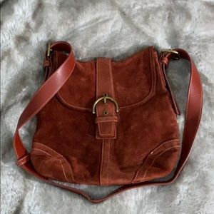 Burnt sienna, suede Coach crossbody.